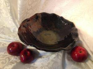 Large brown clay bowl